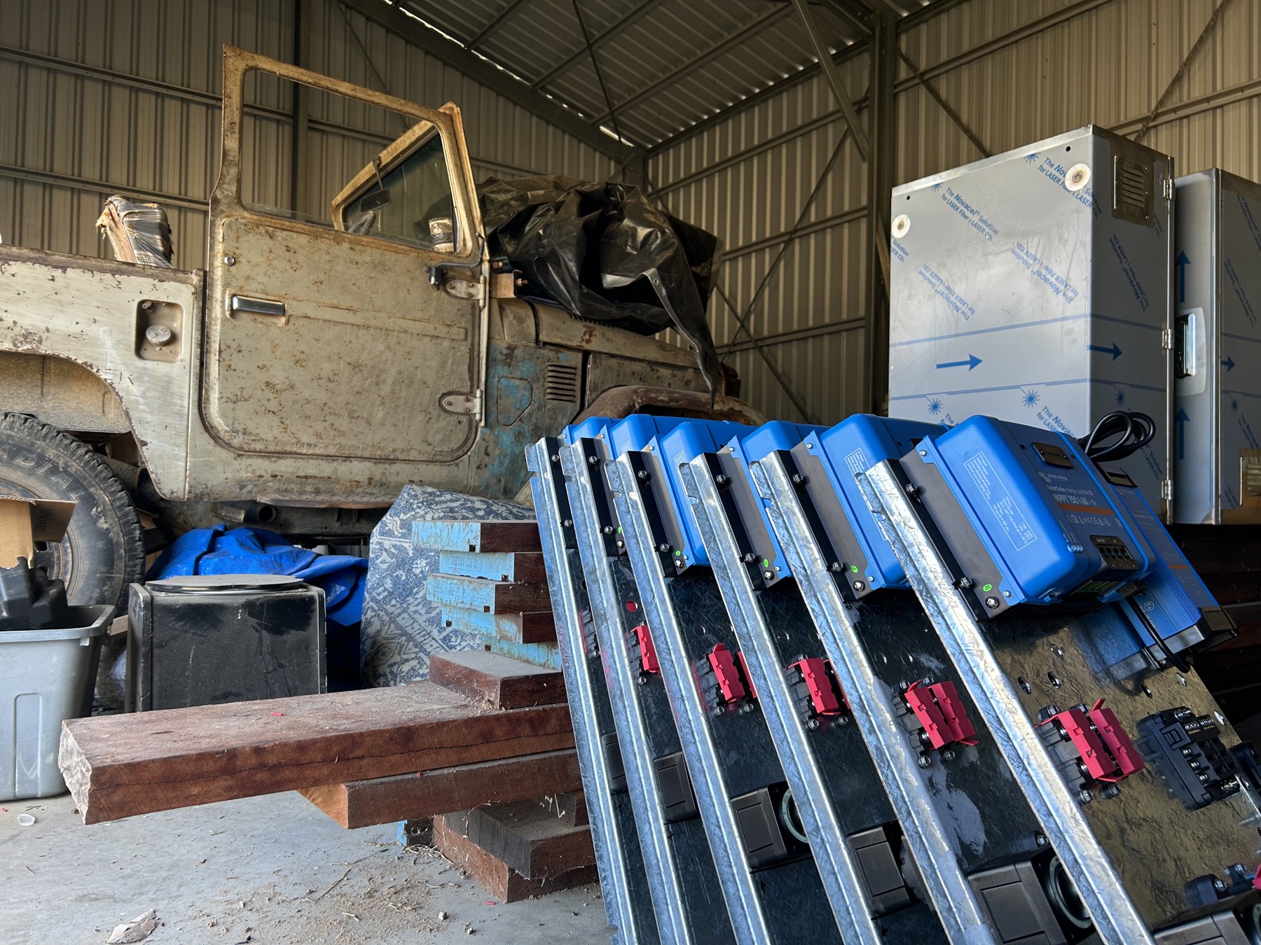 Workshop scene with rugged vehicle and off-grid electrical equipment
